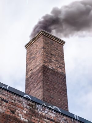 Smoke Pollution From An Old Industrial Factory Chimney, With Shallow Depth of Field