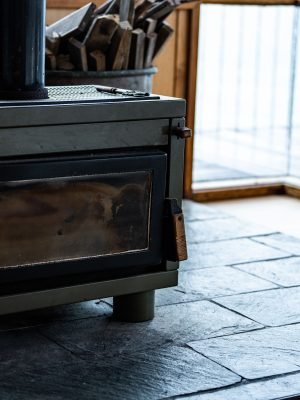 A wood-burning stove with tube at home. closeup shot